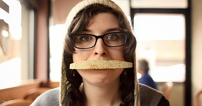 weird woman with fruit peel over her mouth