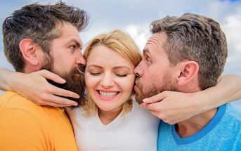 two men kissing each cheek of a woman illustrating an open relationship