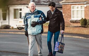 young man helping an elderly man across the road - illustrating random acts of kindness