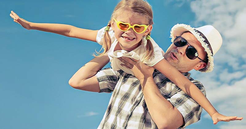 dad playing with his daughter putting her ahead of his new partner