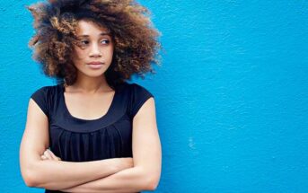 woman with arms crossed illustrating that she pushes people away