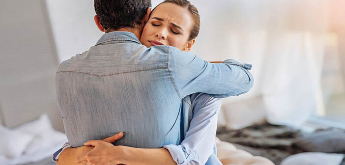 relieved woman hugging her partner after making the relationship work