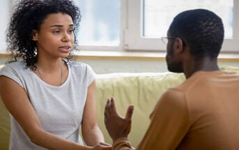 controlling husband making his point as anxious wife listens - illustrating that he thinks he does nothing wrong