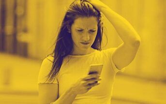 woman looking confused by text from her ex - why do men always come back?