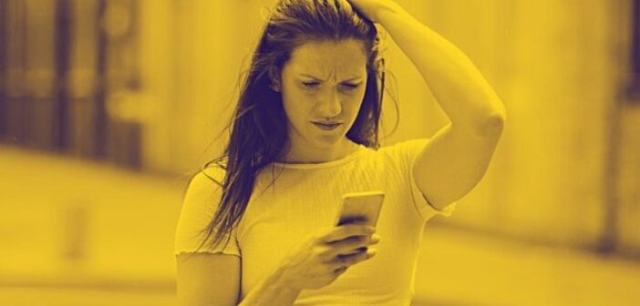 woman looking confused by text from her ex - why do men always come back?