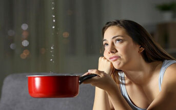 woman holding pan under leaking water from her ceiling - illustrating when nothing goes right