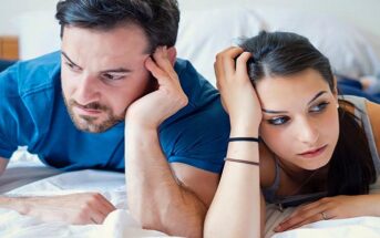 couple looking disengaged in the bedroom because they don't have sex anymore