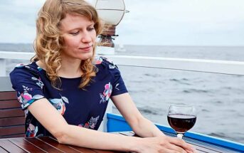 woman sitting alone on a boat feeling alienated by society