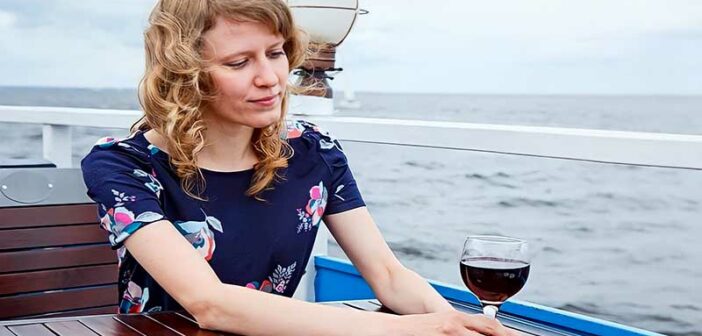 woman sitting alone on a boat feeling alienated by society