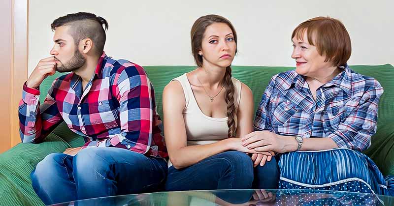 couple sitting on couch with mother-in-law