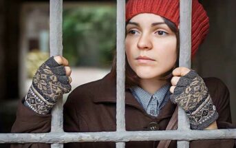 woman looking through bars - illustrating the no contact rule after a breakup with your ex