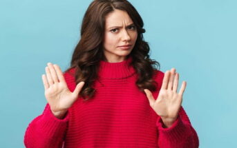 woman being defensive with palms up showing