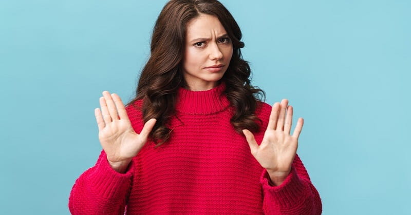woman being defensive with palms up showing