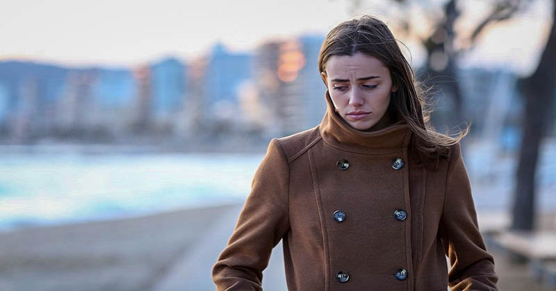 young woman looking troubled wondering whether her life will get better