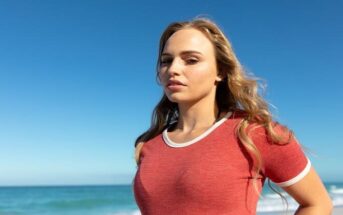 young woman in red t-shirt looking fearless