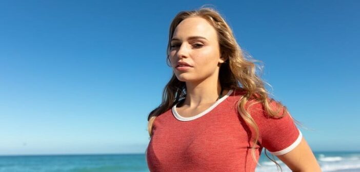 young woman in red t-shirt looking fearless