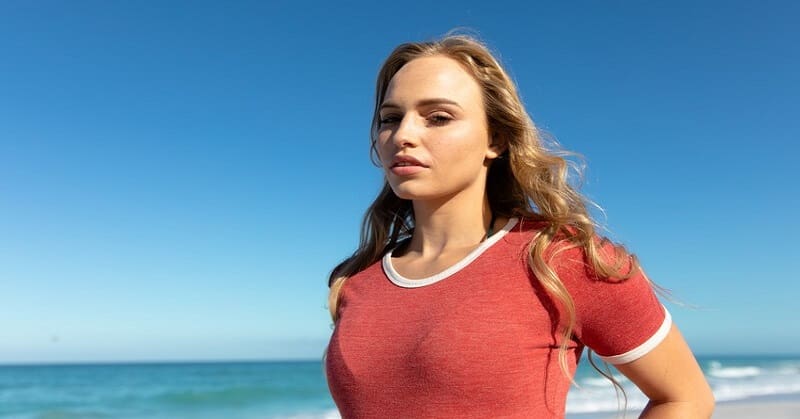 young woman in red t-shirt looking fearless