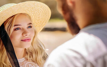 young woman looking at a man whom she is in love with