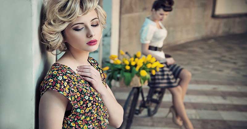 two young women - one in the foreground and one in the background to illustrate letting go of a friendship