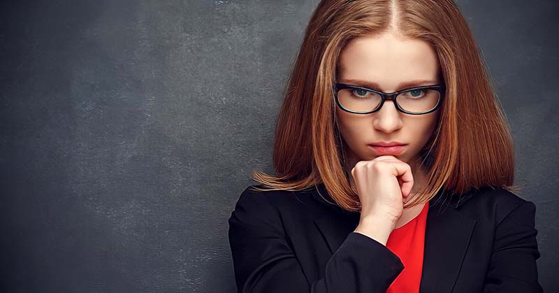 pensive ambitious woman wondering if here ambition is good or bad