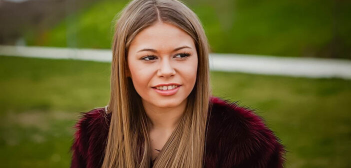 pensive young woman with slight smile - illustrating a good person