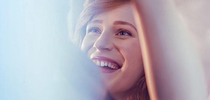 smiling, happy young woman who is confident in her relationship