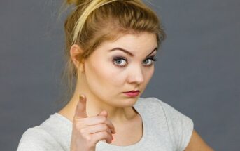 young woman pointing finger illustrating being judgmental