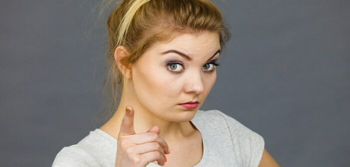 young woman pointing finger illustrating being judgmental