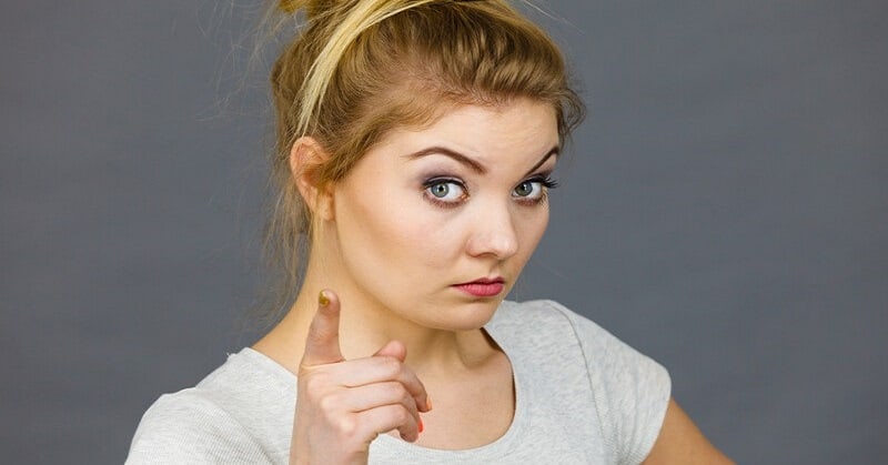 young woman pointing finger illustrating being judgmental