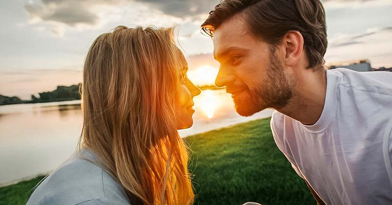 couple staring into each other's eyes at sunset - illustrating he is the one