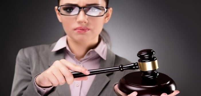 woman with gavel - illustrating judgmental people