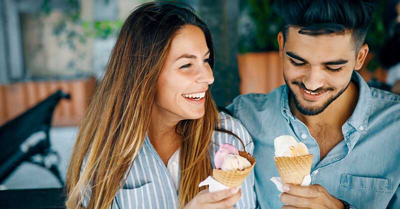 guy and girl eating ice cream on a second date