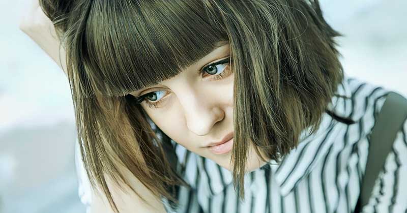 pensive stressed out woman who wants to stop being a people pleaser