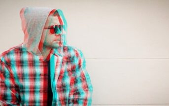 glitched photo of a man with sunglasses on - illustrating holding a grudge