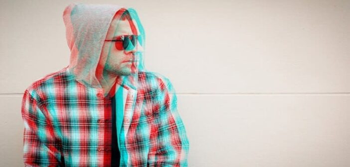 glitched photo of a man with sunglasses on - illustrating holding a grudge