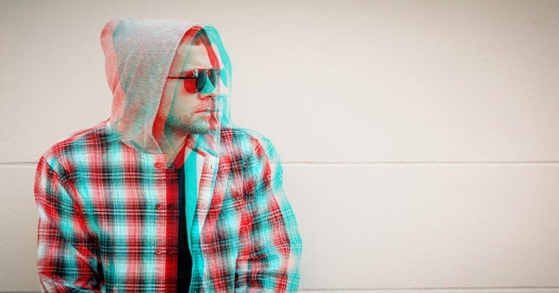 glitched photo of a man with sunglasses on - illustrating holding a grudge