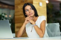young businesswoman deep in thought - illustrating striving for excellence