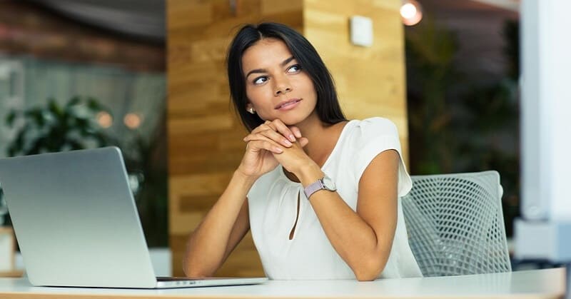 young businesswoman deep in thought - illustrating striving for excellence