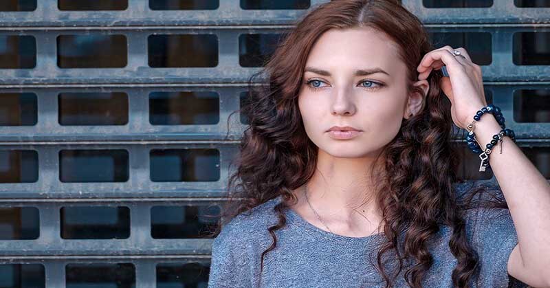 young pensive woman being self-critical