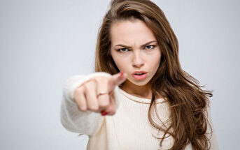 woman pointing finger angrily - illustrating calling someone out on their bad behavior