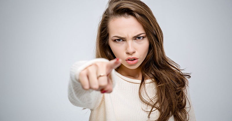 woman pointing finger angrily - illustrating calling someone out on their bad behavior
