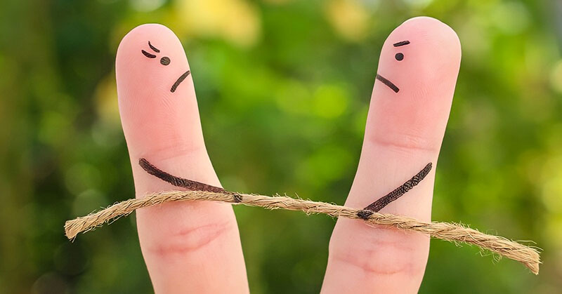 finger couple tug of war - illustrating power struggles in relationships