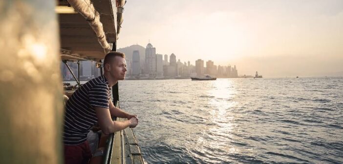 pensive man on a boat seeking to avoid complacency in his life