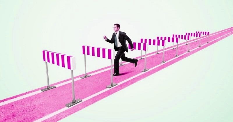 man hurdling barriers to personal growth