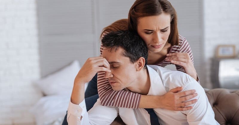 woman trying to comfort stressed partner - illustrating letting your partner's moods affect you