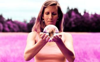 woman holding a crystal ball symbolizing her peace that she's protecting