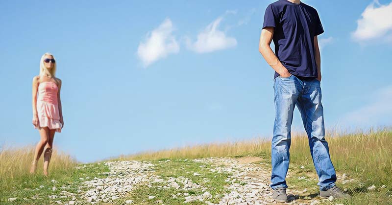 man in foreground with back to woman in background - illustrating someone pushing you away