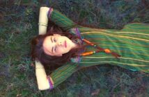 i don't want friends - lone young woman laying down on some grass