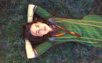 i don't want friends - lone young woman laying down on some grass