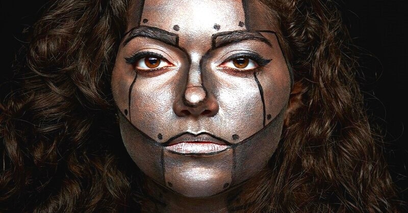 how to be emotionless: woman with robot face paint